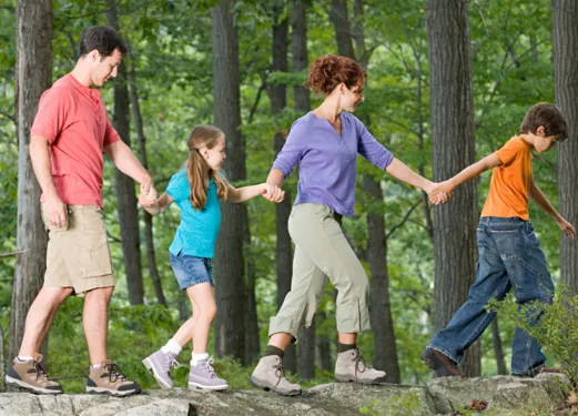 A family hiking together on a forest trail