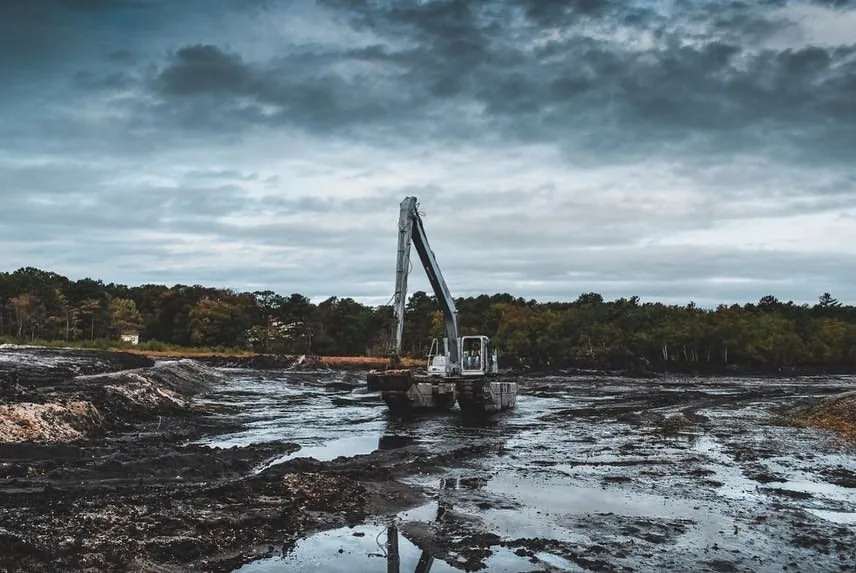 The Remu Big Float E22 amphibious excavator dredging Canaan Lake on Long Island