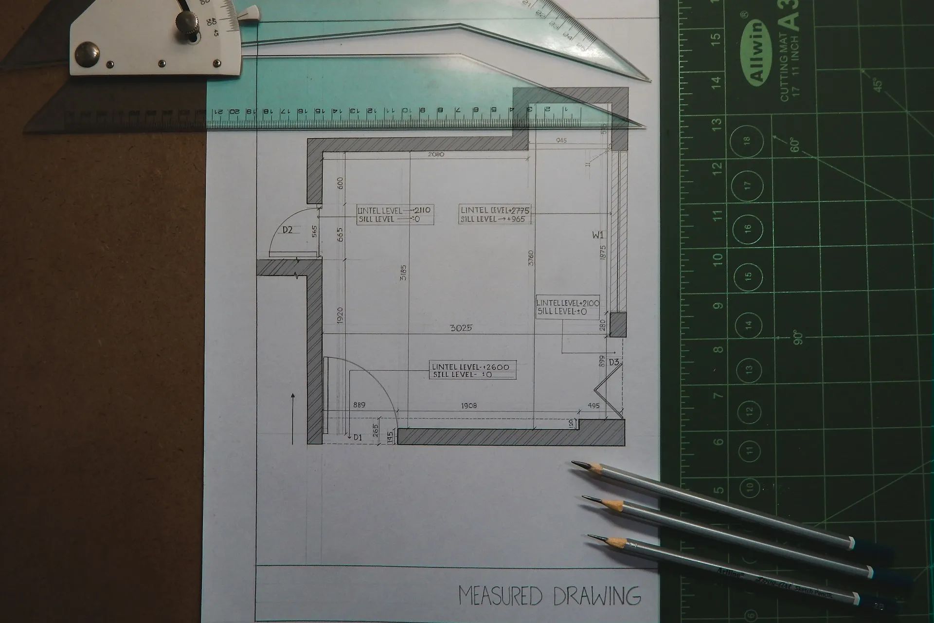 Blueprints and drafting tools for a construction project synced through Egnyte