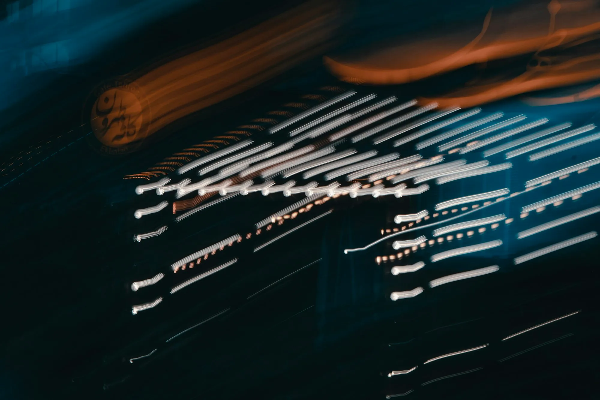 Abstract streaks of light across a dark background