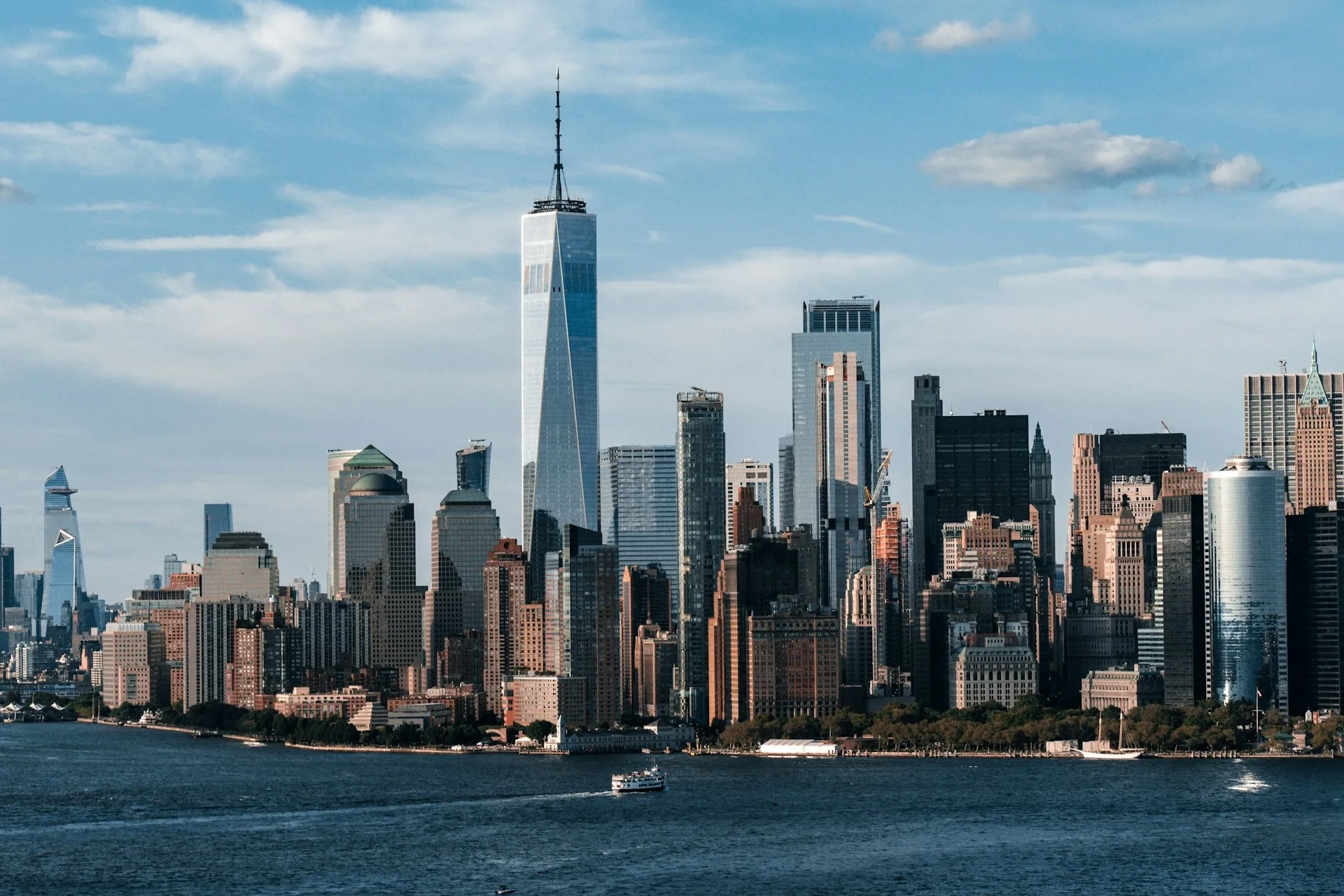 Lower Manhattan skyline under a cloudy sky