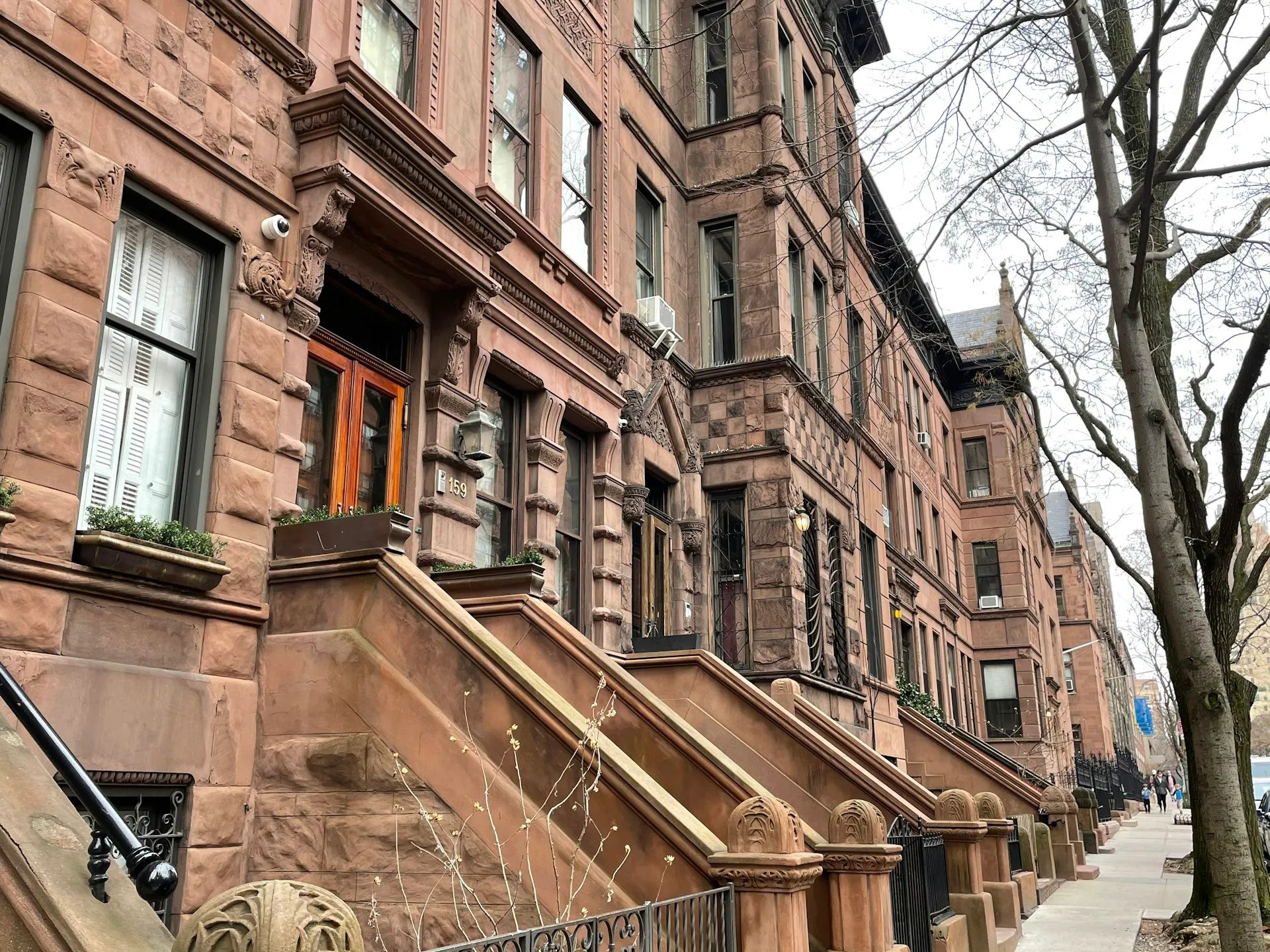 Row of New York brownstones with front stoops