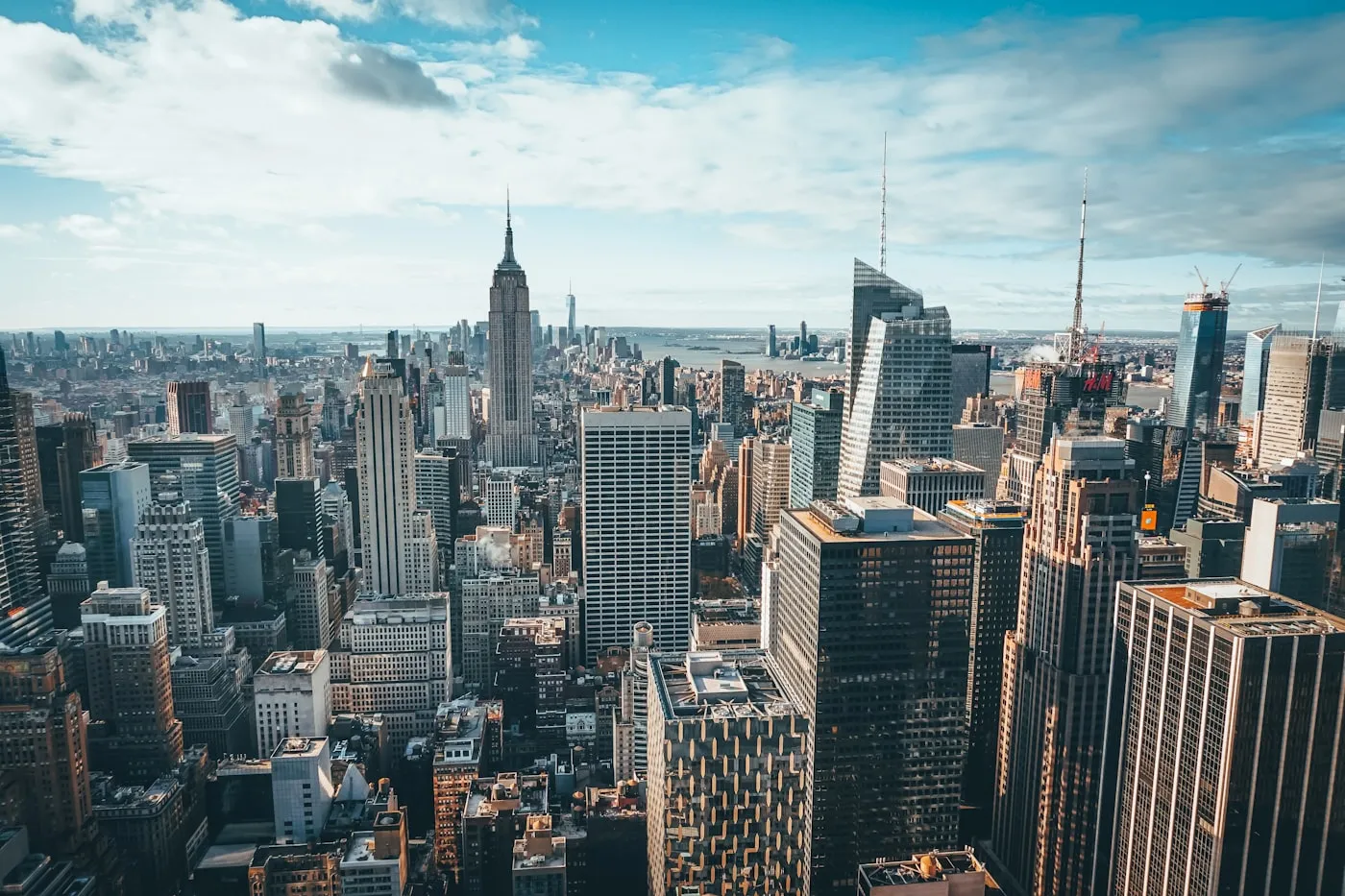 Manhattan office towers under a clear daytime sky