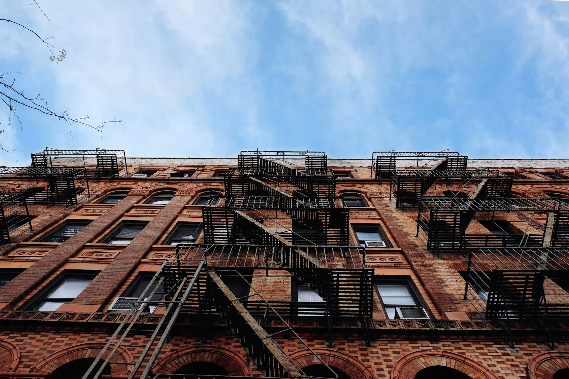 Brick New York walk-up with iron fire escapes