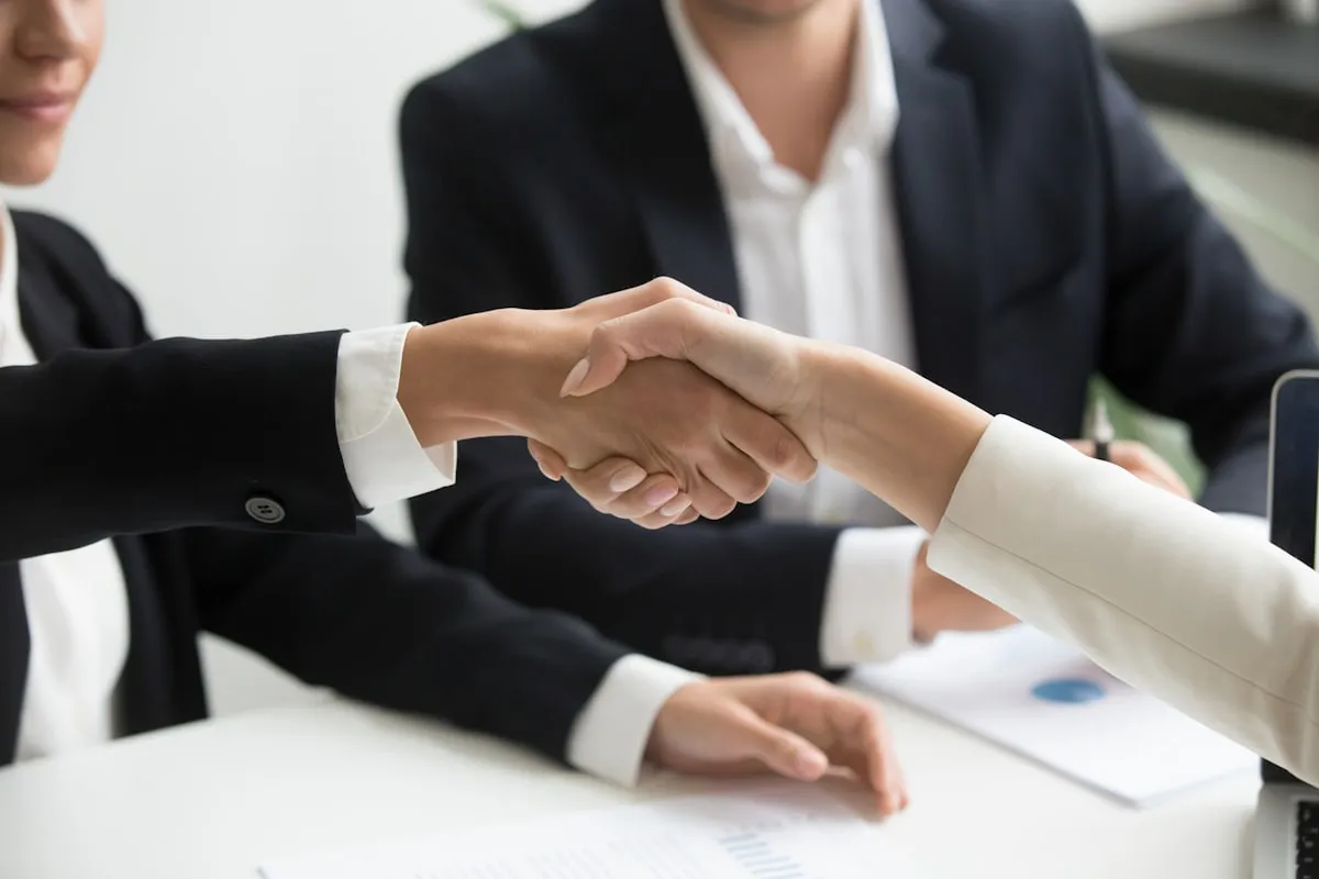 Business handshake sealing a service agreement