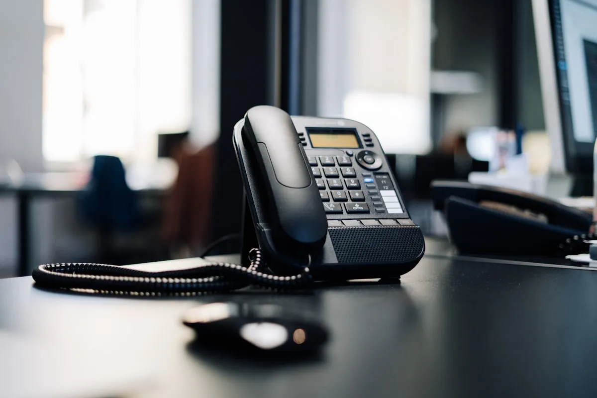 VoIP desk phone in a modern office