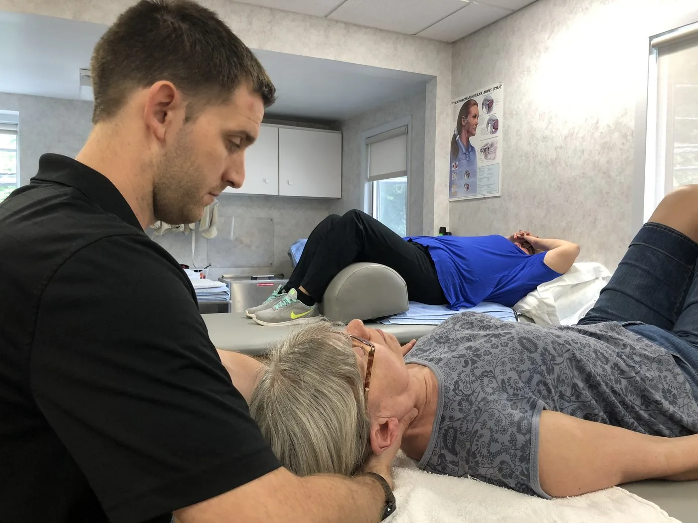 Therapist treating a patient's neck