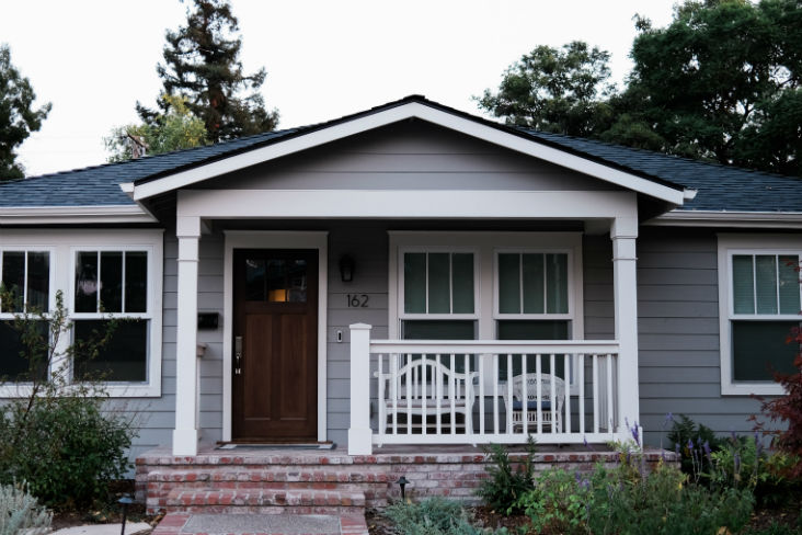 A completed single-family home with a new porch