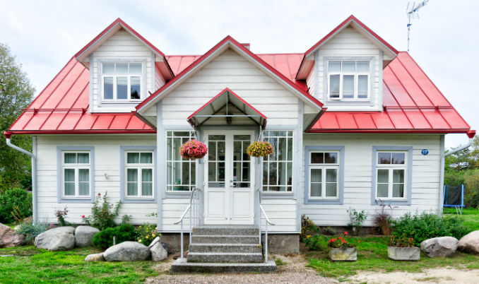 A finished house renovation with a new standing-seam roof