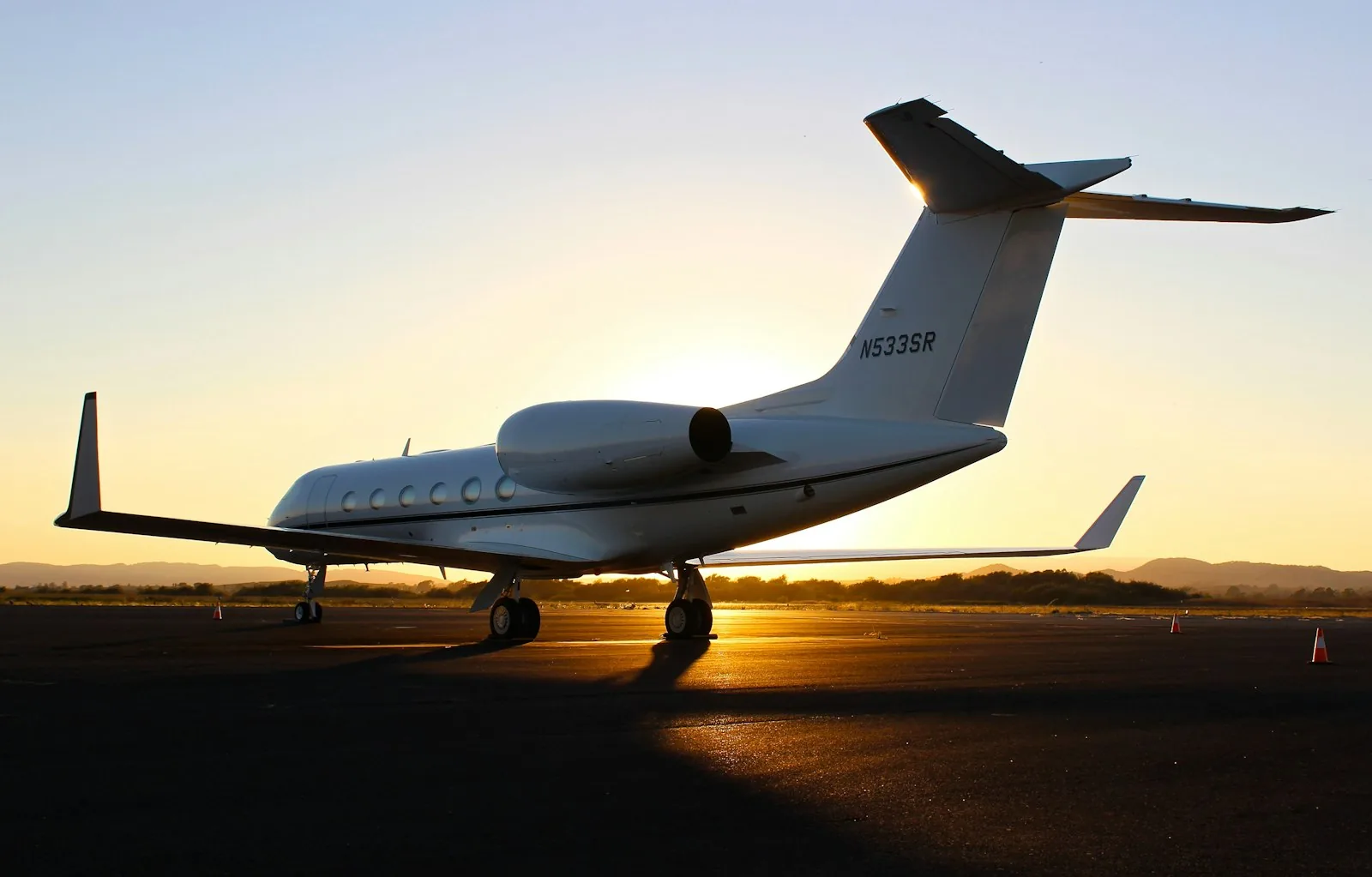 Private medical jet on the runway at sunset